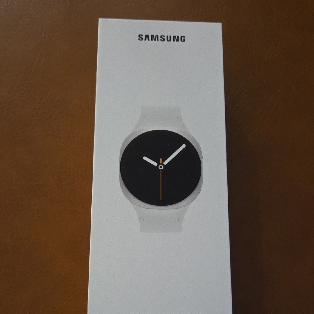 Samsung Smartwatch with White Band and Black Face